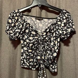 Floral Top, mainly black and white with dots of yellow.